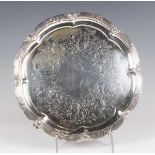 A Victorian silver circular salver, the centre engraved with scrolling stems of flowers and leaves