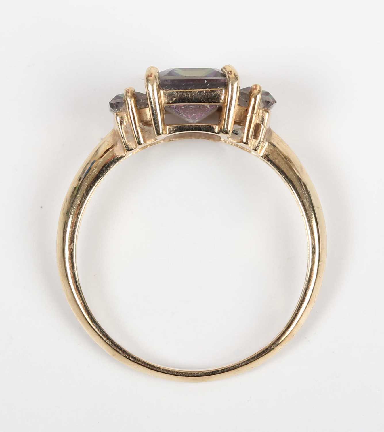 A 9ct gold ring, mounted with a cut cornered rectangular step cut mystic topaz between two smaller - Image 4 of 5