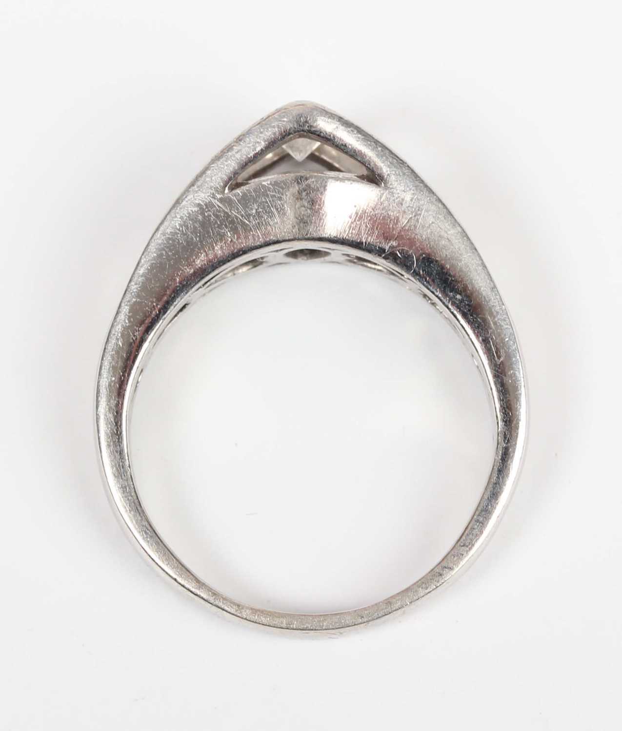 A platinum and diamond ring, mounted with the principal marquise shaped diamond in a raised - Image 4 of 5