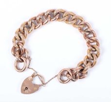A gold decorated and plain hollow curblink bracelet, the links detailed '9c', on a gold heart