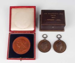 A Victoria Old Head bronze Diamond Jubilee commemorative medallion 1837-1897, diameter 5cm, within