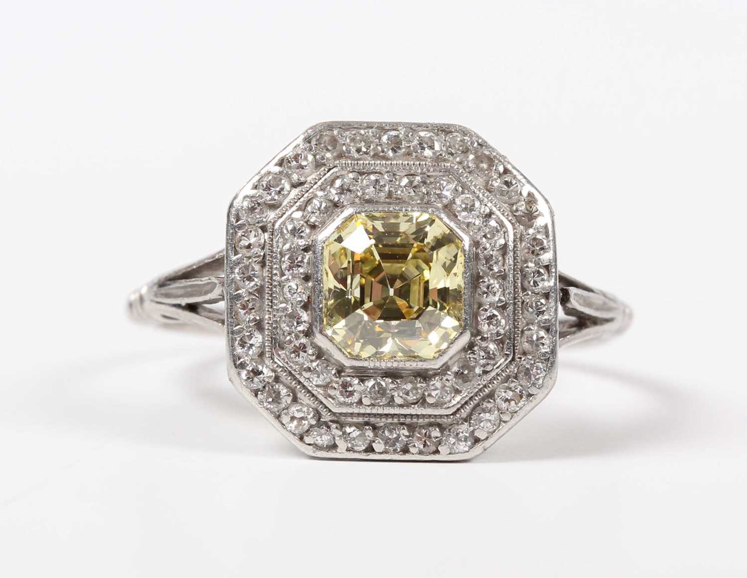 A platinum, fancy intense yellow diamond and diamond ring, mounted with the asscher cut fancy - Image 2 of 6