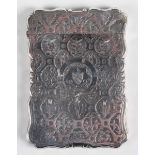 A Victorian silver rectangular card case, the front engraved with a crest within a buckle and