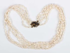 A five row necklace of freshwater cultured pearls on a gold and sapphire clasp, detailed ‘585