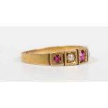 A gold, ruby and half-pearl ring, mounted with three rubies alternating with two half-pearls in