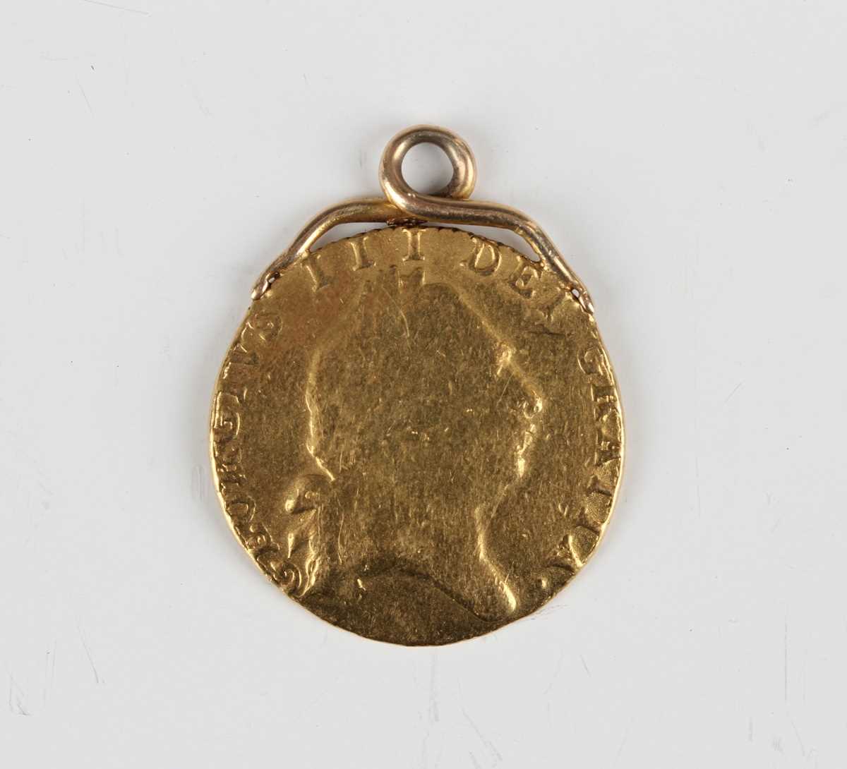 A George III spade half-guinea 1798, later mounted for suspension.