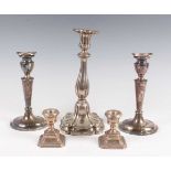 A pair of 20th century Danish sterling silver candlesticks, each with urn shaped sconce and