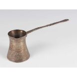 An Egyptian silver coffee pot of waisted cylindrical form with pouring lip and flat handle, all