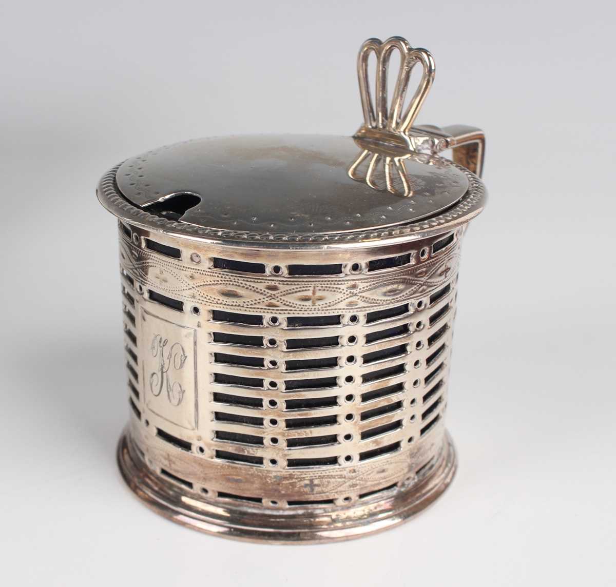 A Victorian silver pierced cylindrical mustard with hinged lid and pierced thumbpiece, flanked by - Image 2 of 3