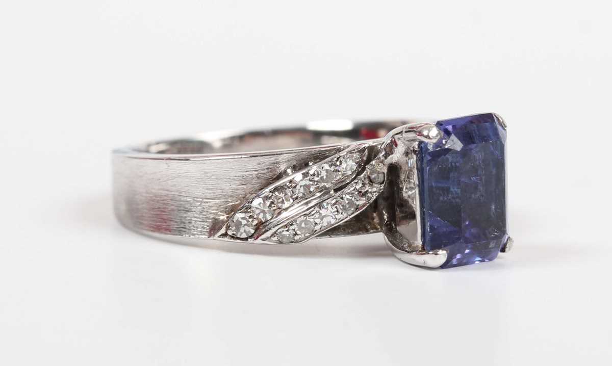 A white gold, tanzanite and diamond ring, claw set with the cut cornered rectangular tanzanite - Image 6 of 10