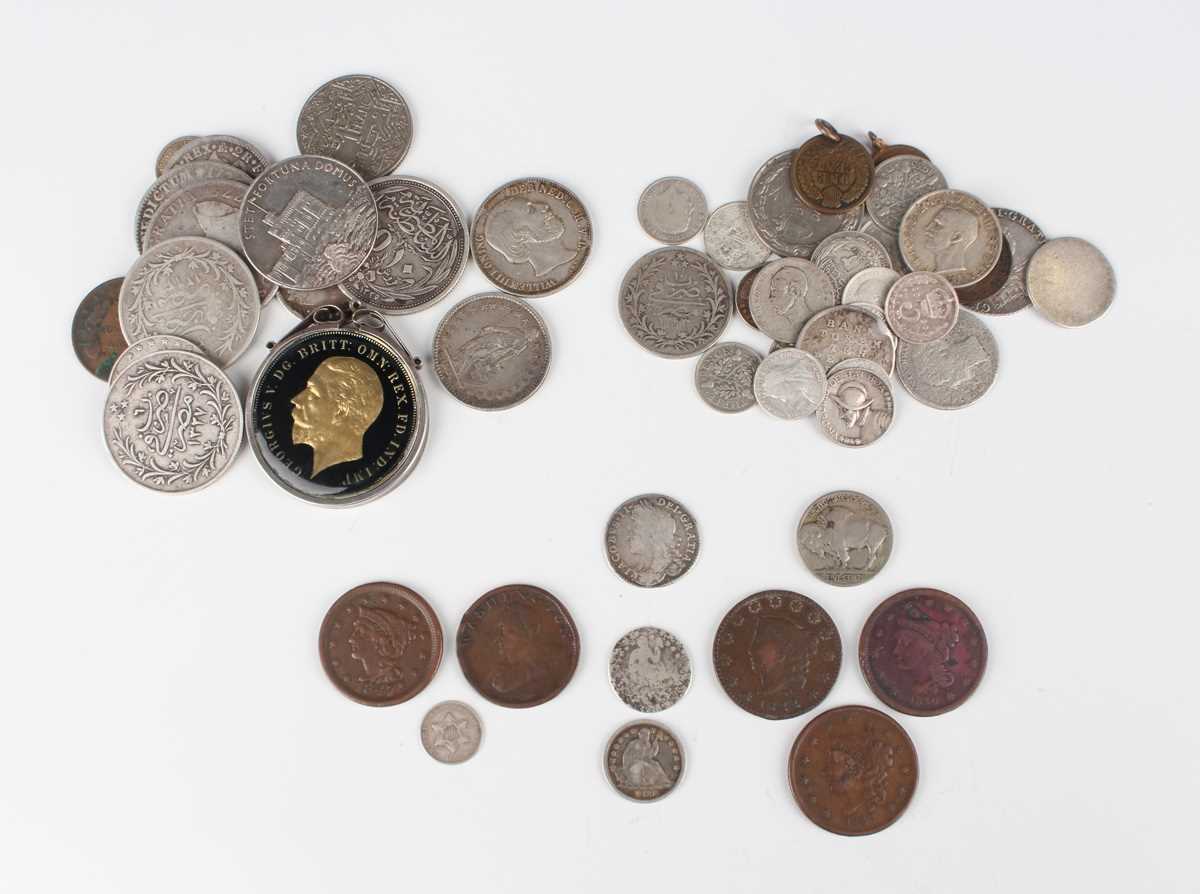 A collection of European and world coinage, including a James II sixpence 1687 and a group of USA