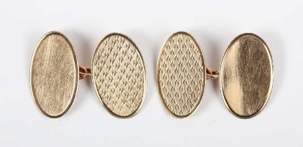 A pair of 9ct gold oval cufflinks, each engine turned to one side, Birmingham 1962, weight 4.6g,