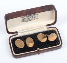 A pair of 9ct gold oval cufflinks with partial engine turned decoration, Birmingham 1931, weight 4.