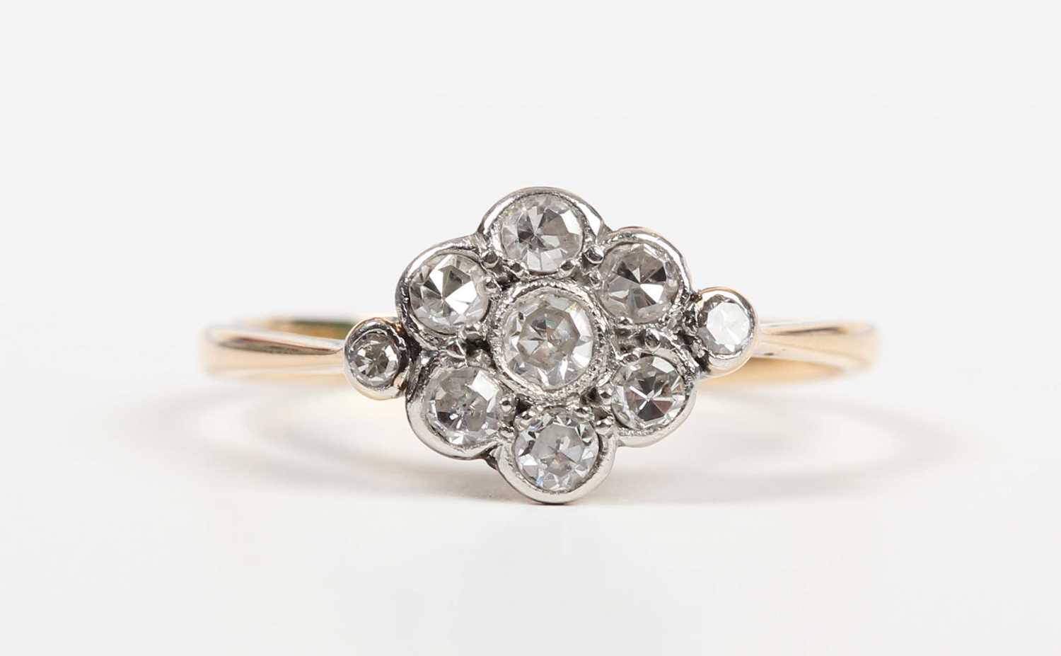 A gold, platinum and diamond nine stone cluster ring in a lozenge shaped design, mounted with - Image 2 of 5