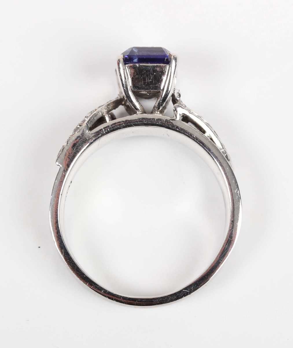 A white gold, tanzanite and diamond ring, claw set with the cut cornered rectangular tanzanite - Image 9 of 10