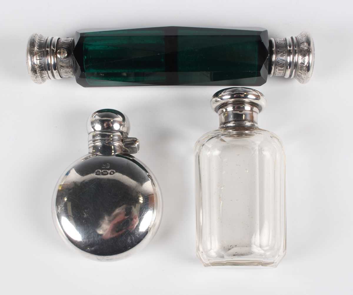 A George V silver hip flask of curved circular form with screw hinged lid, Birmingham 1921 by George