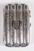 An Edwardian silver four-division cigar case with overall engraved decoration and a vacant shield