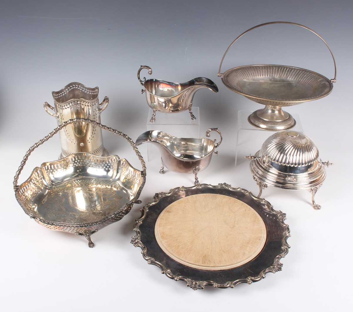 A group of plated items, including a pair of entrées dishes and covers, syphon stand, a pair of