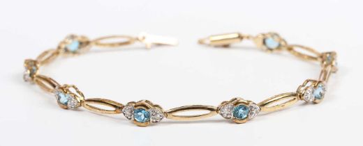 A 9ct gold, diamond and treated blue topaz bracelet, mounted with a row of circular cut treated blue