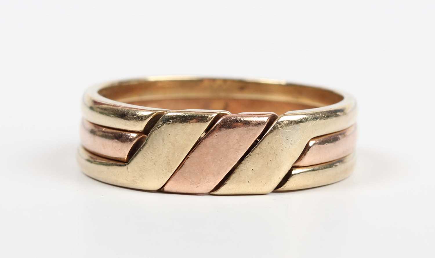 A 9ct three colour gold three section puzzle ring, weight 6.9g, ring size approx V1/2. - Image 2 of 5