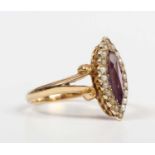 A gold, amethyst and seed pearl marquise shaped ring, mounted with the marquise shaped amethyst