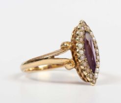 A gold, amethyst and seed pearl marquise shaped ring, mounted with the marquise shaped amethyst