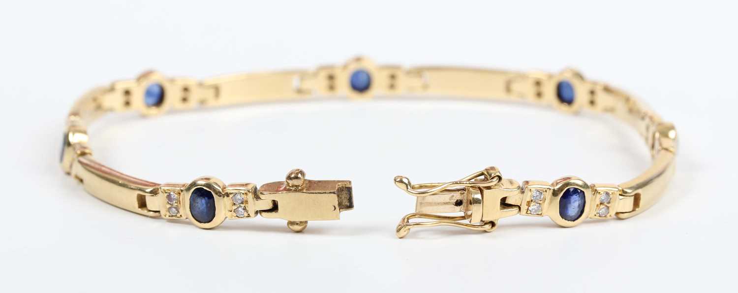 A gold, sapphire and diamond bracelet, mounted with oval cut sapphires between pairs of circular cut - Image 2 of 3