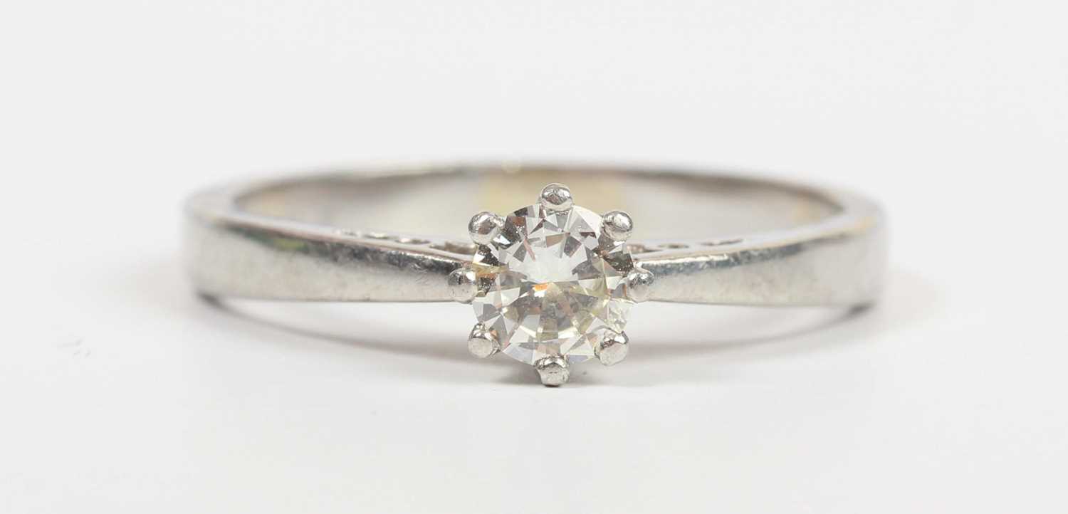 A platinum and diamond single stone ring, claw set with a circular cut diamond, detailed ‘.33ct’ - Image 2 of 5