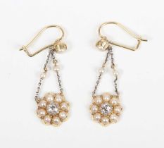 A pair of gold, diamond and half-pearl cluster pendant earrings, each drop mounted with an old cut