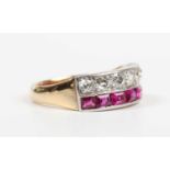 A gold, ruby and diamond ring, mounted with a row of seven old cut diamonds and a row of seven