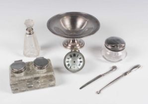 An Edwardian silver mounted cut glass rectangular twin inkstand, the circular hinged lidded inkwells