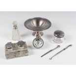 An Edwardian silver mounted cut glass rectangular twin inkstand, the circular hinged lidded inkwells