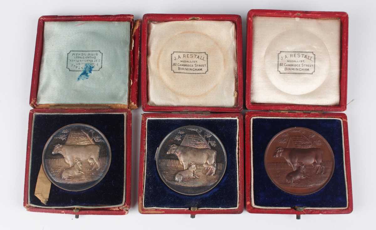 A group of three late 19th century silver and bronze British Dairy Farmers Association