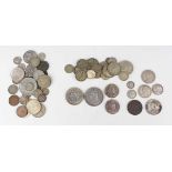 A small collection of British and world coins and banknotes, including a Victoria Jubilee Head crown