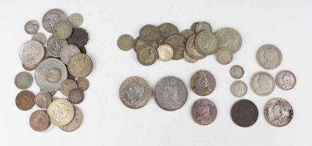 A small collection of British and world coins and banknotes, including a Victoria Jubilee Head crown