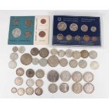 A small collection of various European and world silver and metal coinage, including a Switzerland