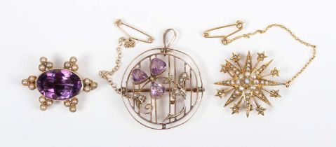 A gold, amethyst and seed pearl pendant brooch in a circular design with a trefoil and spray