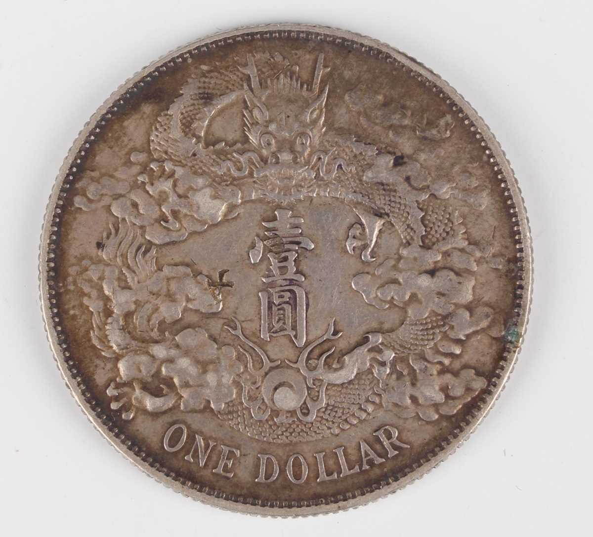 A China Xuantong era yuan Dragon dollar, year 3, 1911, reverse with dragon winding left with value