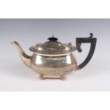 A George V silver cushion shaped teapot on ball feet, Birmingham 1926 by Henry Matthews, weight