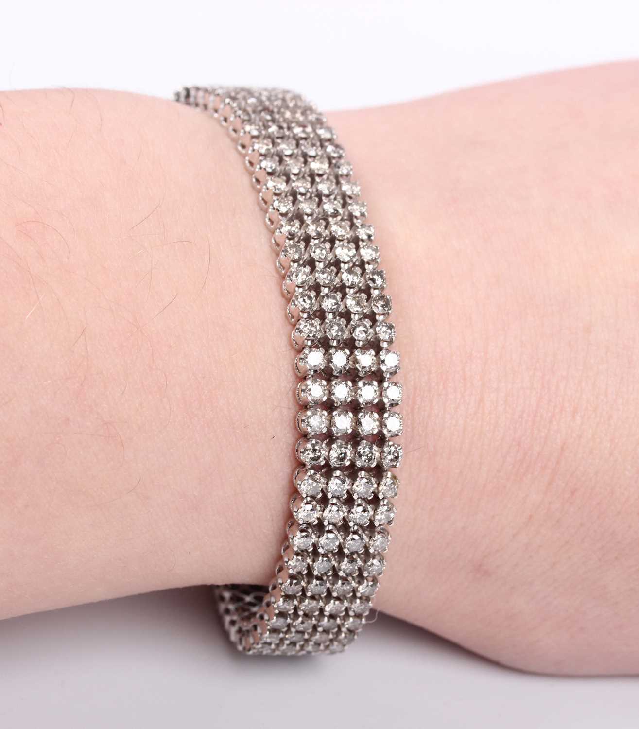 A white gold and diamond bracelet, mounted with four rows of circular cut diamonds, on a snap clasp, - Image 3 of 3