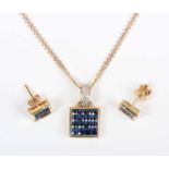 A gold, sapphire and diamond pendant of square form, mounted with sixteen square cut sapphires, with