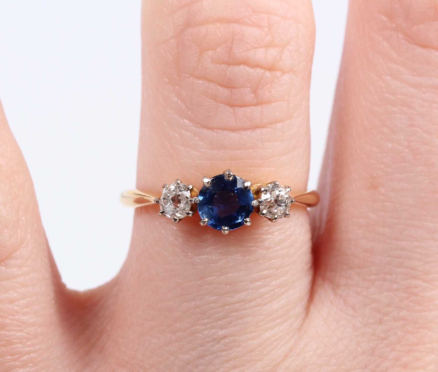 A gold, platinum, sapphire and diamond ring, claw set with a circular cut sapphire between two old - Image 5 of 5