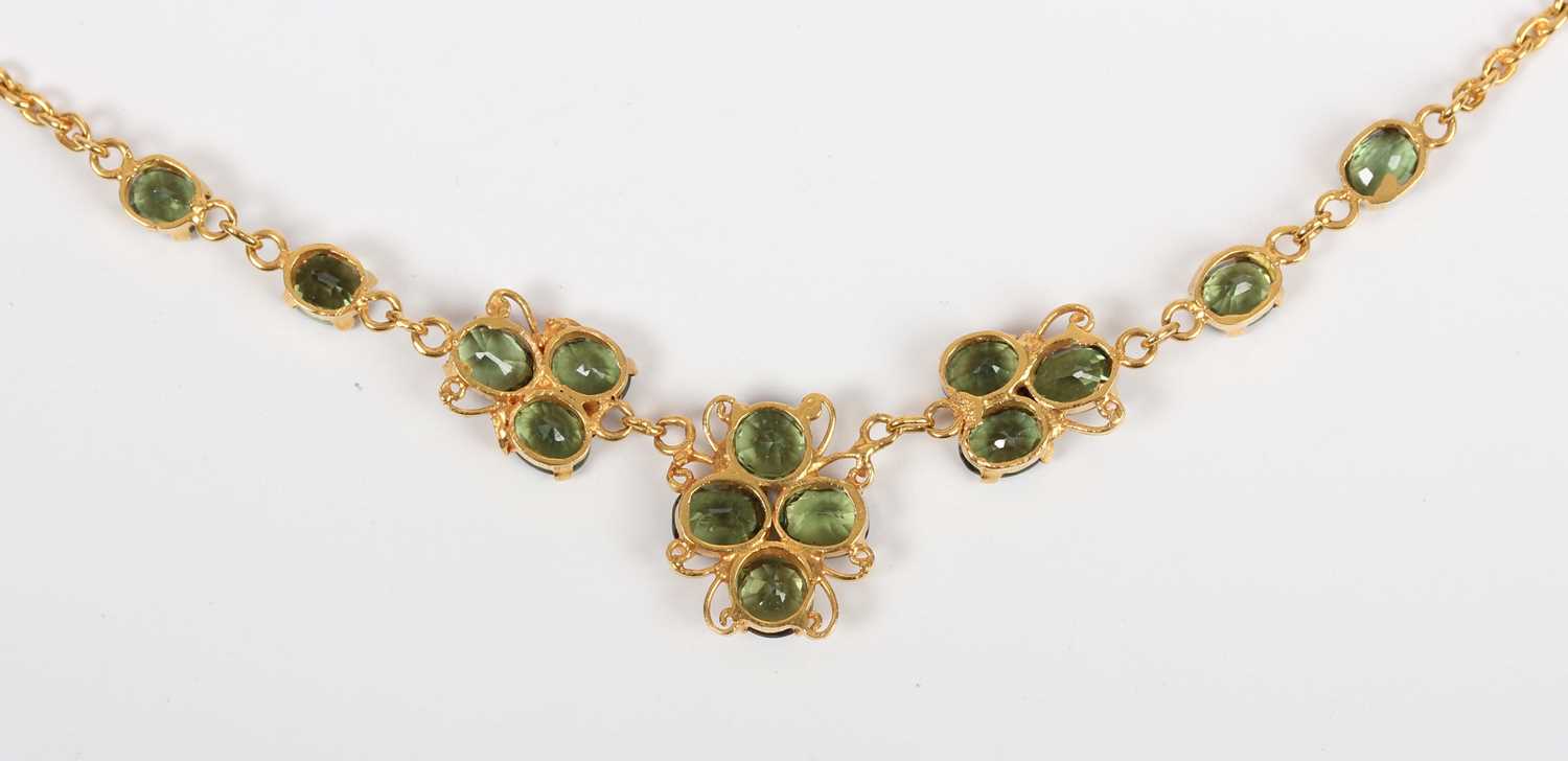A gold and green sapphire necklace, the front in a scrolling design mounted with oval cut green - Image 3 of 3