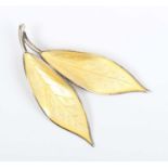 A Norwegian David Anderson sterling silver and pale yellow enamelled brooch, designed as a pair of