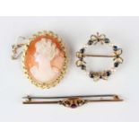 A 9ct gold, sapphire and cultured pearl brooch of circular design with tied bow motifs at intervals,