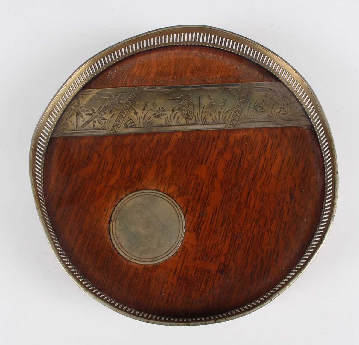 A late Victorian plate mounted circular tray, the oak base inset with a circular plaque beneath an - Image 2 of 7