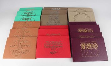 A large collection of Elizabeth II Royal Mint year-type specimen coin sets, all within