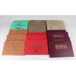 A large collection of Elizabeth II Royal Mint year-type specimen coin sets, all within