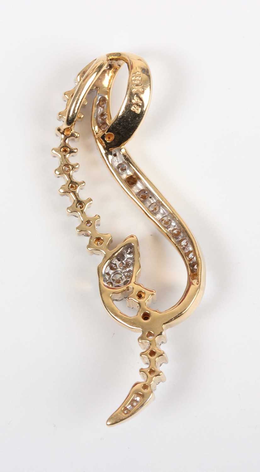 A gold and diamond pendant in an openwork scrolling design, detailed ‘18K 47’, length 3.7cm, and a - Image 5 of 5