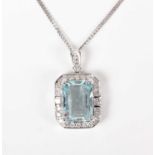 A white gold, aquamarine and diamond cluster pendant, claw set with the cut cornered rectangular